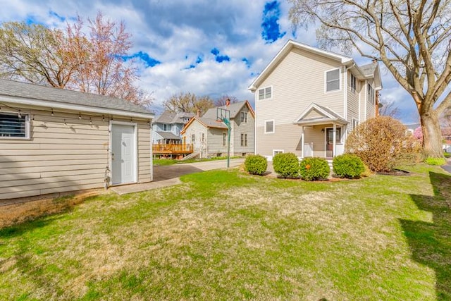 rear view of property with a yard and a residential view