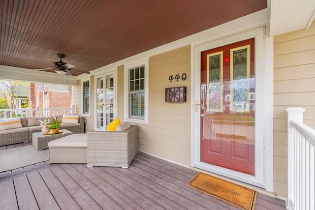 deck featuring a porch, ceiling fan, french doors, and an outdoor hangout area