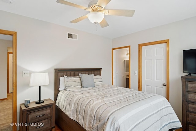 bedroom with ceiling fan and visible vents