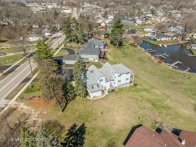 bird's eye view with a water view and a residential view