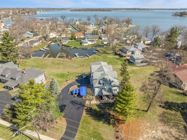 bird's eye view with a water view and a residential view