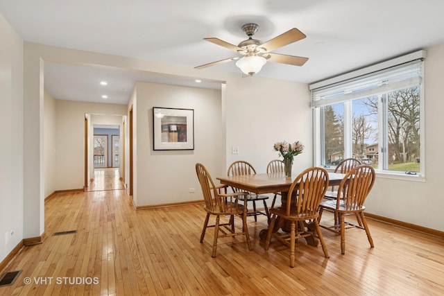 dining area with light wood-style floors, recessed lighting, visible vents, and baseboards