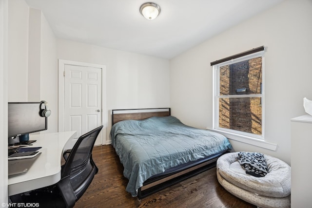 bedroom featuring wood finished floors