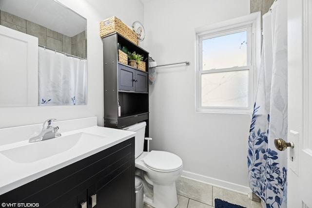 bathroom featuring baseboards, a shower with curtain, toilet, vanity, and tile patterned flooring