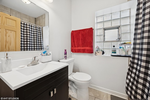 full bath with tile patterned flooring, curtained shower, vanity, and toilet