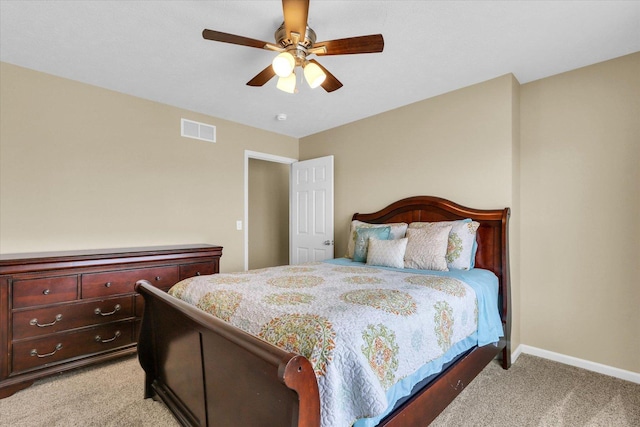 bedroom featuring baseboards, ceiling fan, light carpet, and visible vents
