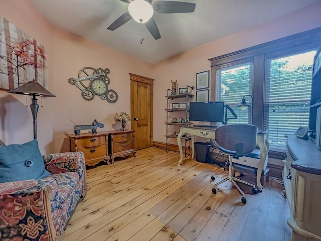 home office with a ceiling fan and hardwood / wood-style floors