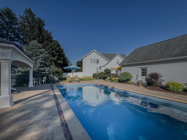 view of pool with a patio, a fenced in pool, and fence