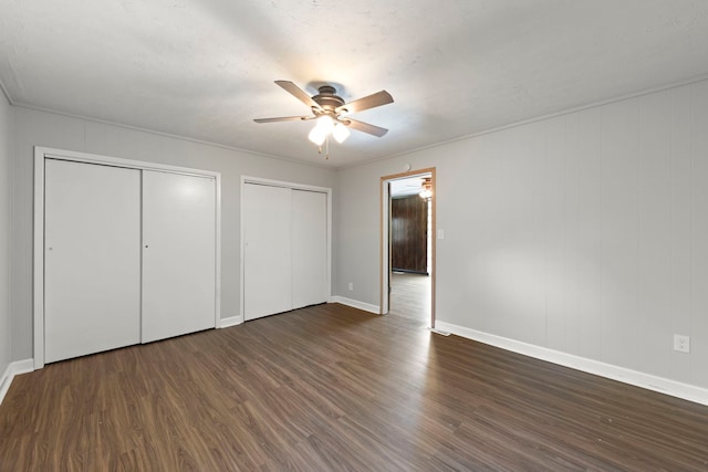 120 Anderson Ave, Joliet, IL 60433 - unfurnished bedroom with multiple closets, wood finished floors, and baseboards