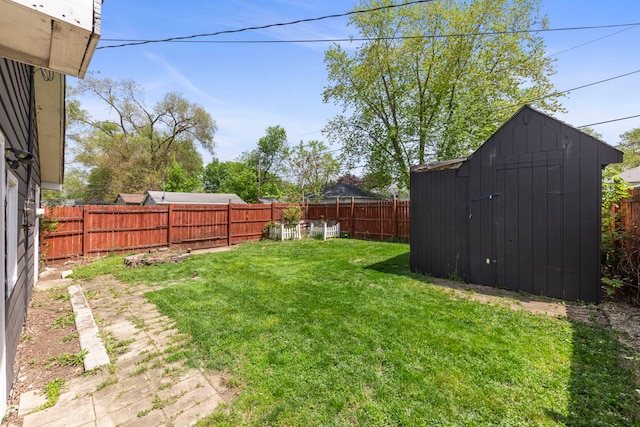 120 Anderson Ave, Joliet, IL 60433 - view of yard with a storage unit and an outbuilding