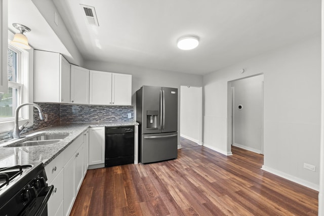 120 Anderson Ave, Joliet, IL 60433 - kitchen featuring black appliances, a sink, white cabinetry, and decorative backsplash