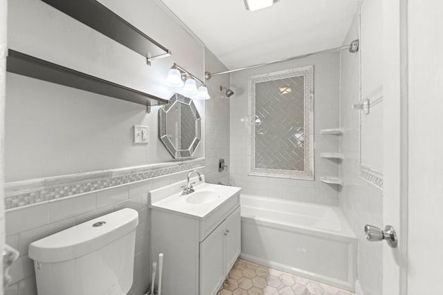120 Anderson Ave, Joliet, IL 60433 - bathroom featuring washtub / shower combination, toilet, vanity, tile patterned flooring, and tile walls