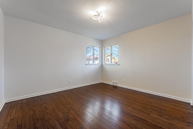 4313 Elm Ave, Lyons, IL 60534 - empty room featuring dark wood-style floors and baseboards