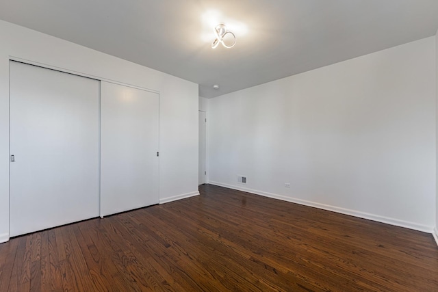 4313 Elm Ave, Lyons, IL 60534 - unfurnished bedroom with dark wood finished floors and a closet