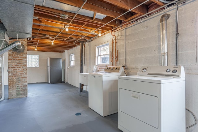 4313 Elm Ave, Lyons, IL 60534 - laundry area with independent washer and dryer and concrete block wall