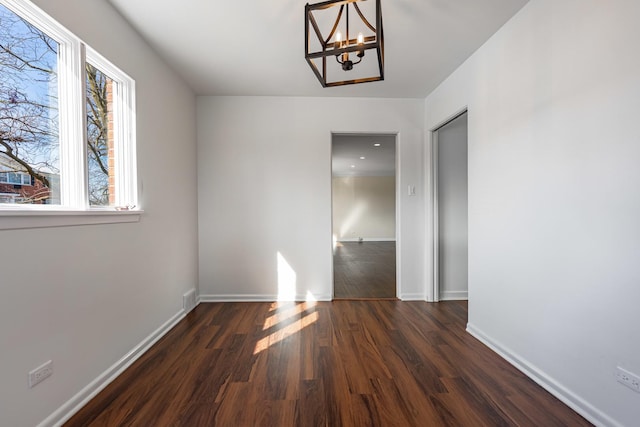 4313 Elm Ave, Lyons, IL 60534 - unfurnished dining area featuring a chandelier and wood finished floors