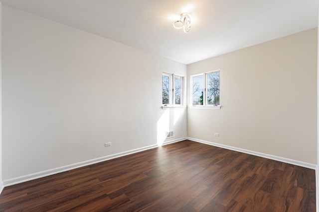 4313 Elm Ave, Lyons, IL 60534 - empty room featuring dark wood-type flooring and baseboards