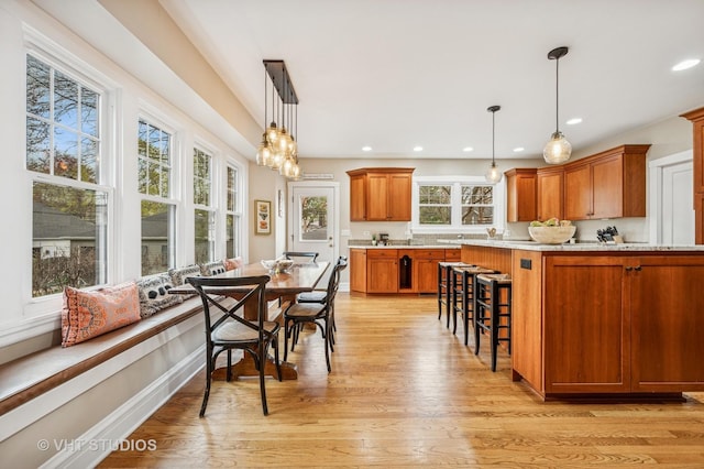 dining room featuring light wood finished floors and recessed lighting