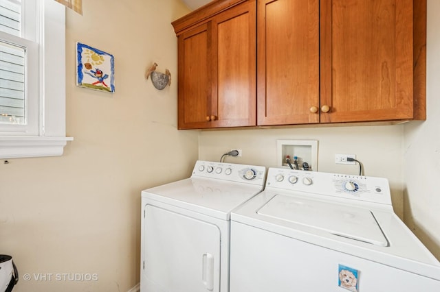 laundry area featuring cabinet space and washer and clothes dryer