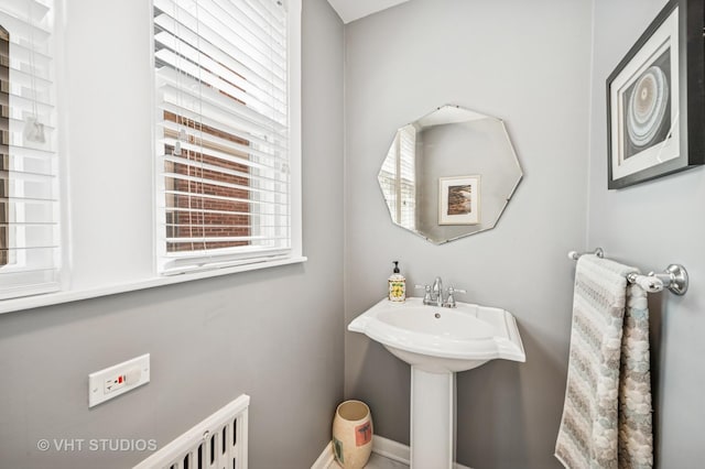 bathroom with baseboards