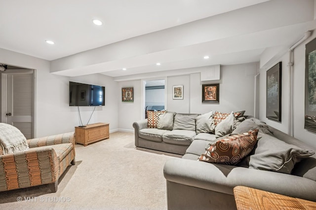 living area featuring recessed lighting and light colored carpet