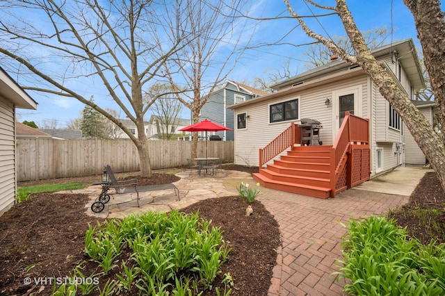 back of property with a patio and fence