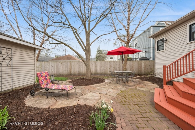 view of patio / terrace featuring outdoor dining area and a fenced backyard