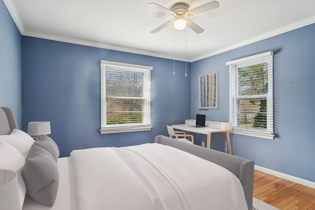 1019 Rockland Rd, Lake Bluff, IL 60044 - bedroom with multiple windows, wood finished floors, ornamental molding, and ceiling fan