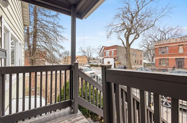 wooden terrace with a residential view