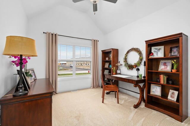 office area featuring carpet floors, vaulted ceiling, and ceiling fan