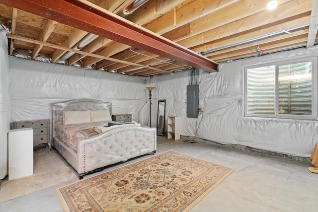 bedroom featuring concrete floors and electric panel