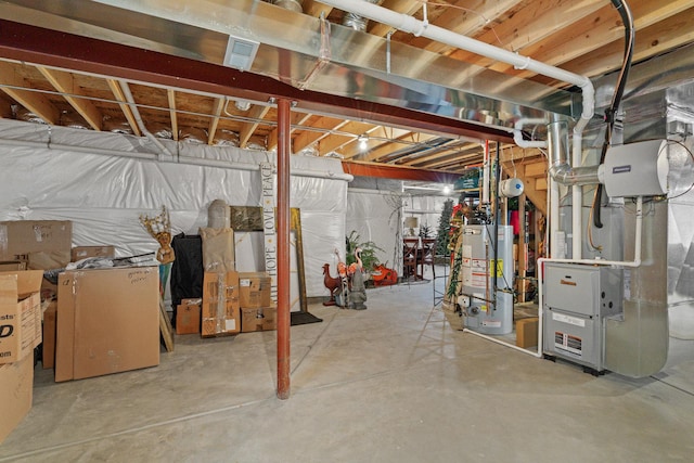 unfinished below grade area with heating unit, water heater, and visible vents