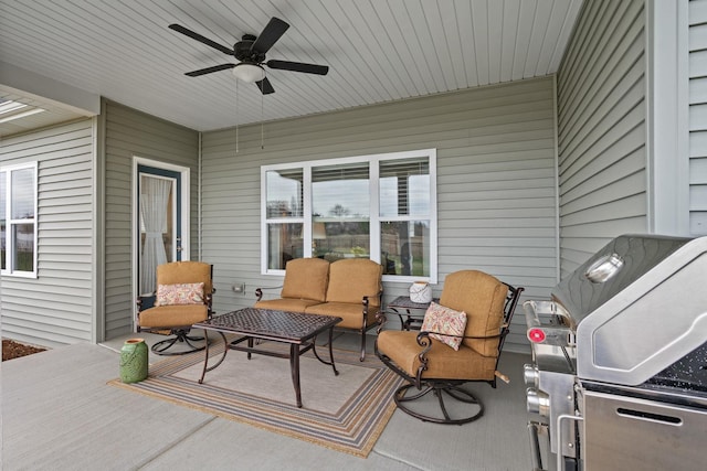 view of patio featuring grilling area, an outdoor hangout area, and a ceiling fan