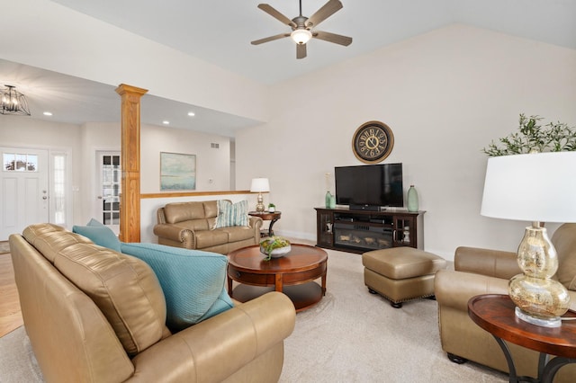 living room featuring vaulted ceiling, recessed lighting, ornate columns, visible vents, and a ceiling fan
