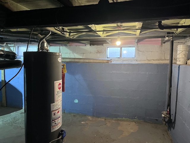 below grade area featuring water heater