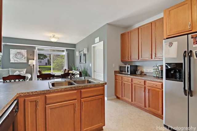 1242 Chesterton Dr Unit 2, Fox Lake, IL 60020 - kitchen with appliances with stainless steel finishes, a sink, and brown cabinets