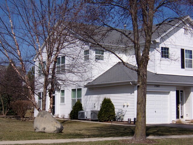 1242 Chesterton Dr Unit 2, Fox Lake, IL 60020 - view of side of property featuring a lawn and an attached garage