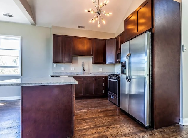 kitchen with visible vents, a notable chandelier, a sink, and stainless steel appliances