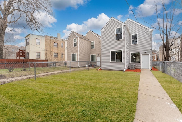 exterior space featuring a fenced backyard and a front yard