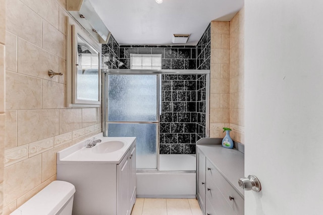 3134 W 39th Pl, Chicago, IL 60632 - full bath featuring tile walls, vanity, bath / shower combo with glass door, and tile patterned flooring