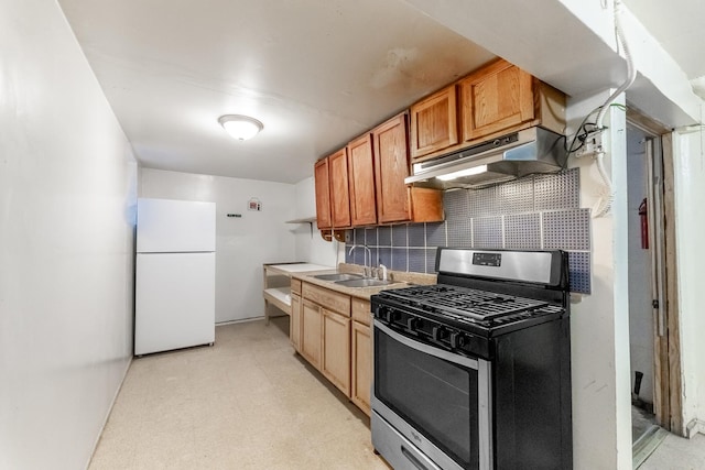 3134 W 39th Pl, Chicago, IL 60632 - kitchen with gas stove, freestanding refrigerator, under cabinet range hood, decorative backsplash, and light flooring