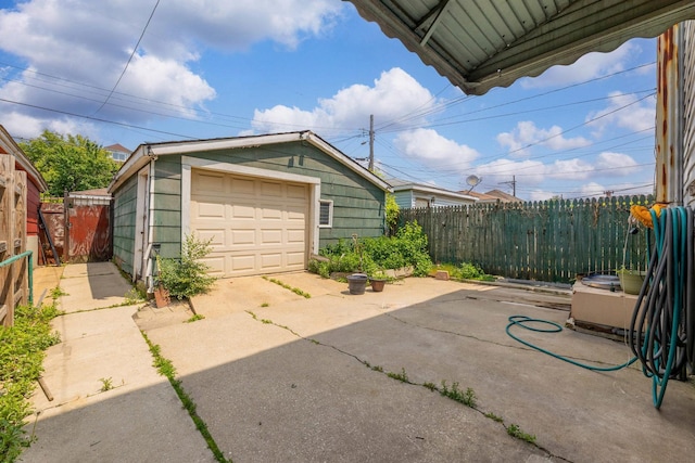 3134 W 39th Pl, Chicago, IL 60632 - view of patio / terrace featuring a detached garage and an outbuilding
