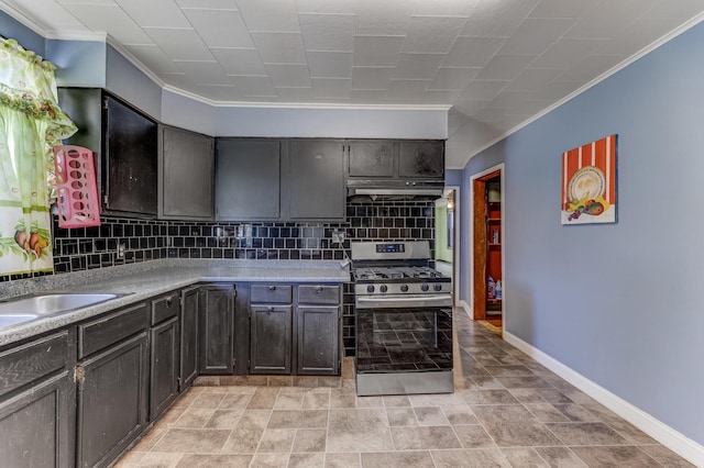 3134 W 39th Pl, Chicago, IL 60632 - kitchen featuring stainless steel gas range, under cabinet range hood, crown molding, backsplash, and light countertops