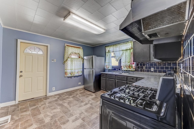 3134 W 39th Pl, Chicago, IL 60632 - kitchen with freestanding refrigerator, extractor fan, black gas range oven, backsplash, and ornamental molding