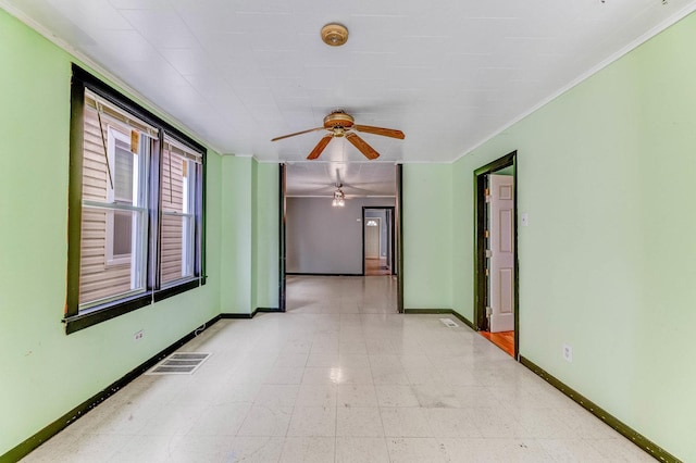 3134 W 39th Pl, Chicago, IL 60632 - spare room with a ceiling fan, light flooring, and crown molding