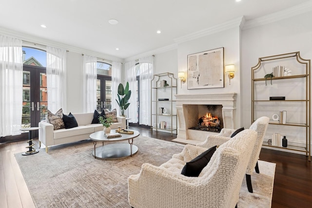 living area with a wealth of natural light, french doors, and ornamental molding