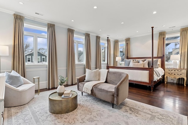bedroom featuring recessed lighting, crown molding, visible vents, and wood finished floors