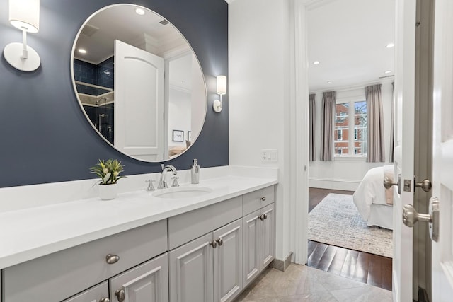 bathroom featuring ensuite bathroom, crown molding, recessed lighting, and vanity