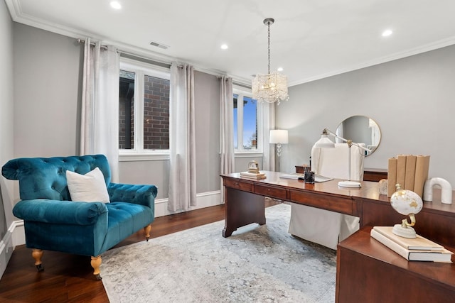 office with ornamental molding, visible vents, and wood finished floors