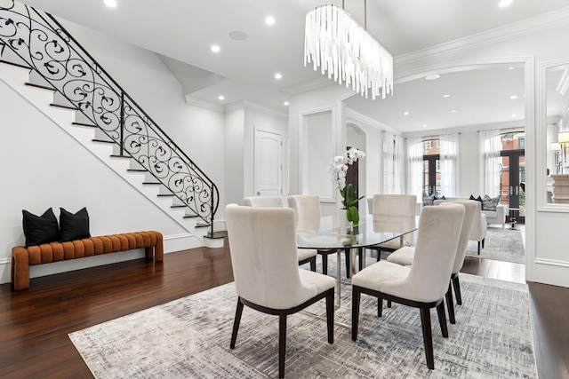 dining area with recessed lighting, ornamental molding, stairs, and wood finished floors